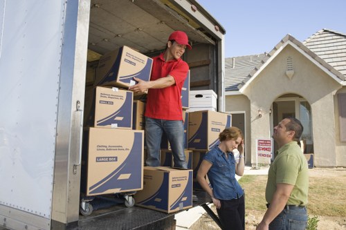 Professional removals loading boxes from a Knightsbridge property