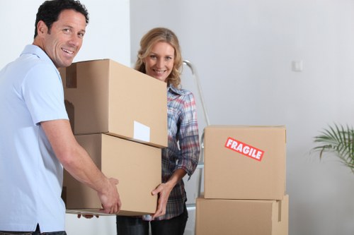 Professional movers loading furniture for a local relocation